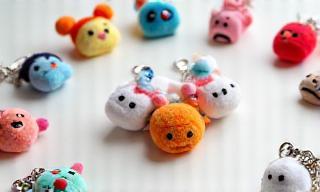 Assortment of anime character keychains, plushies, and bags.